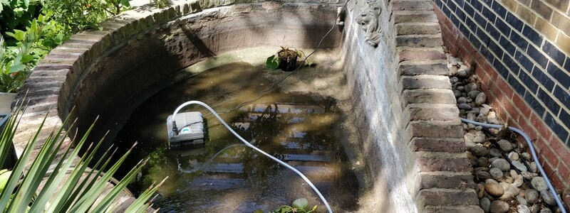 Urban garden pond resealing with impermax liquid rubber paint in Dalston, London.