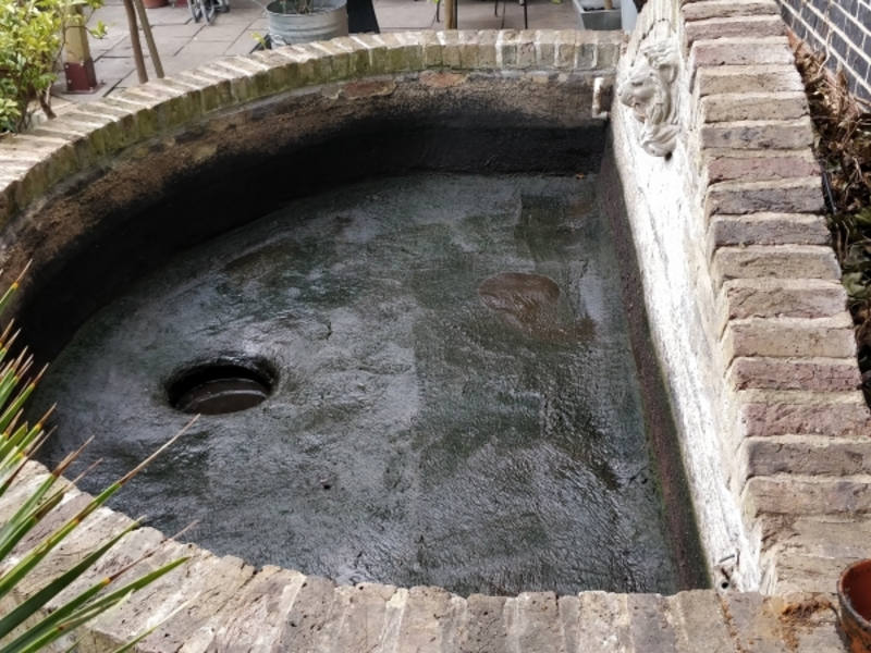 Urban garden pond resealing with impermax liquid rubber paint in Dalston, London.