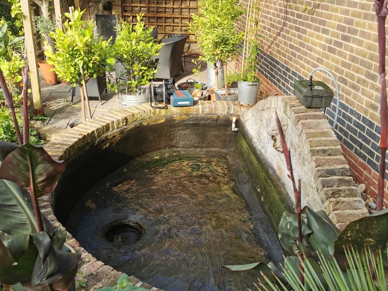 Urban garden pond resealing with impermax liquid rubber paint in Dalston, London.