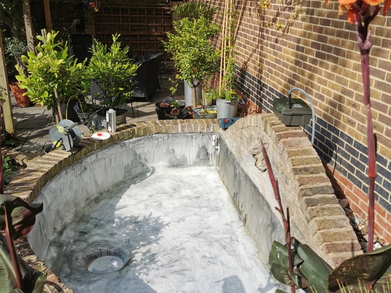 Urban garden pond resealing with impermax liquid rubber paint in Dalston, London.