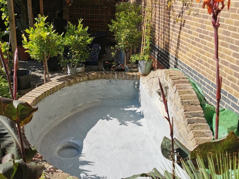 Urban garden pond resealing with impermax liquid rubber paint in Dalston, London.